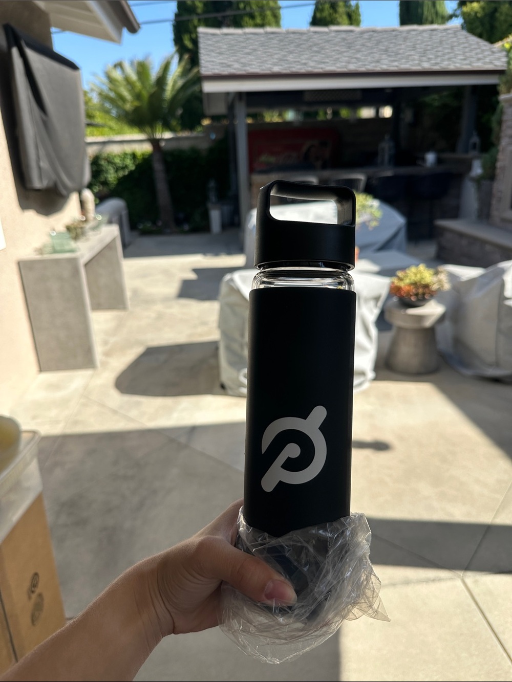 Peloton Black Glass Water Bottle with White Logo and Handle